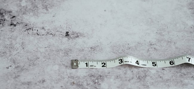 White tape measure on white background 