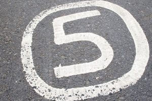 Number 5 painted on asphalt